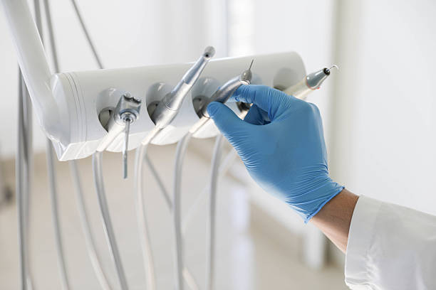 Professional Tooth Extraction technician working in Morrisonville, IL